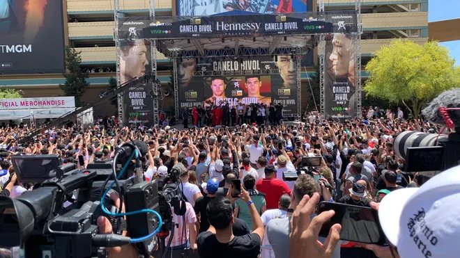 The Canelo vs. Bivol weigh-in on the Allegiant Stage at Toshiba Plaza, packed with fans and press.
