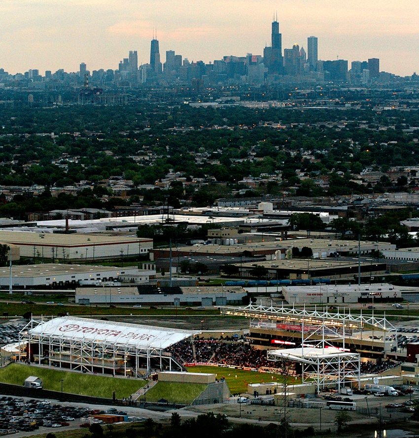 Aerial view of Toyota Park with the Chicago skyline on the horizon.